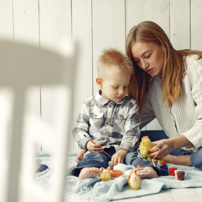 mother-with-son-preparing-easter-home_1157-32928